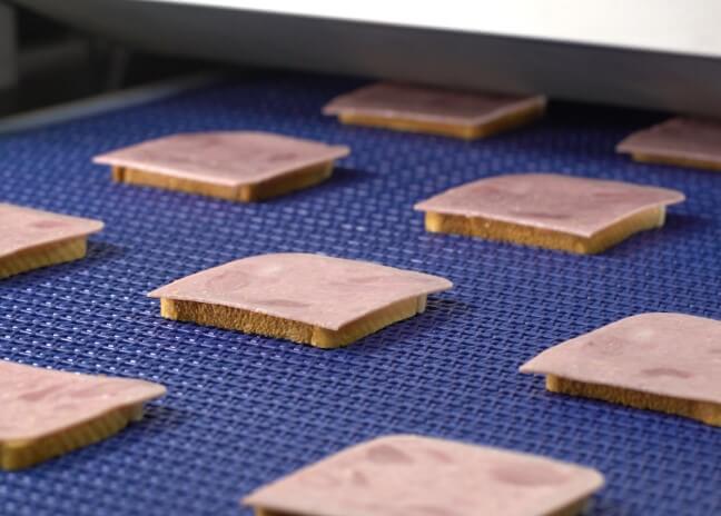 Bacon strips on Grote high speed slicer